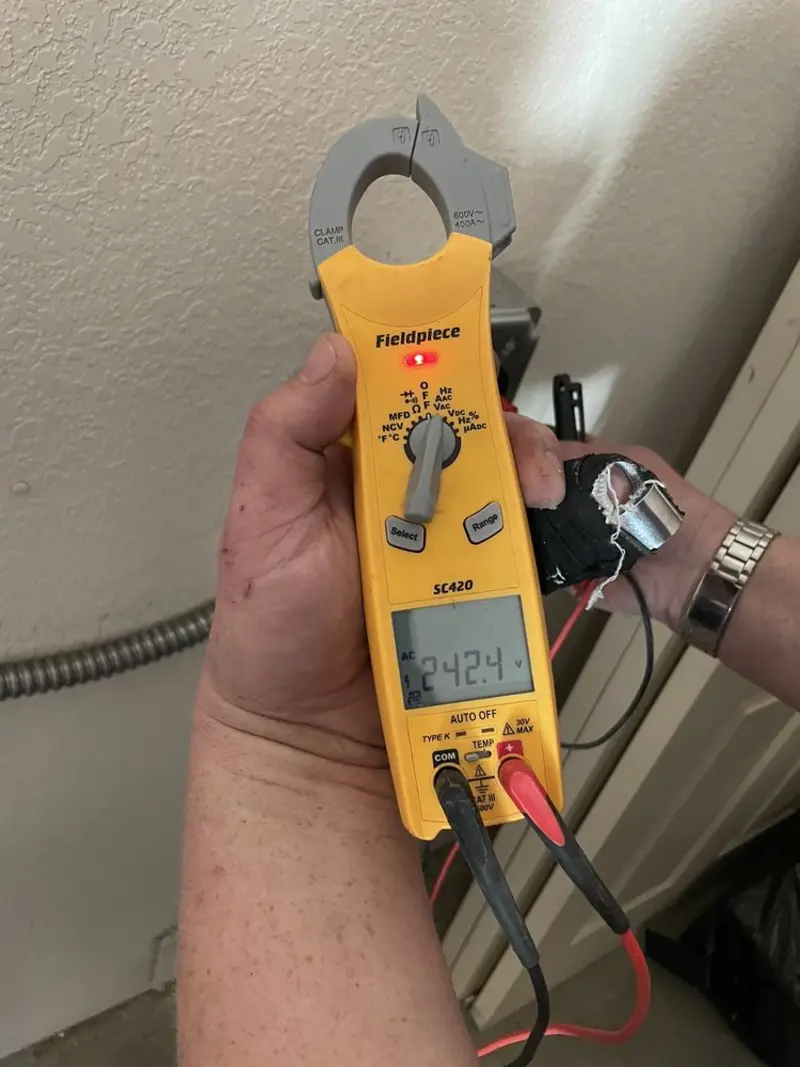 Voltage testing with clamp meter during Outlet Installation in Winfield